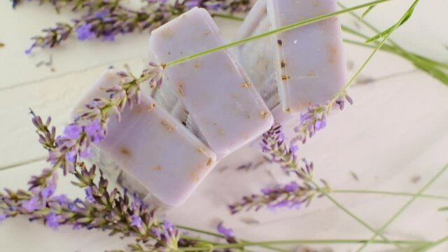 Bars of Lavender soap and lavender flowers.Aromatherapy and spa. cosmetic with lavender extract.4k footage