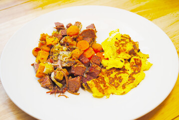 Corned Beef Hash with a Side Dish of Scrambled Eggs - obrazy, fototapety, plakaty