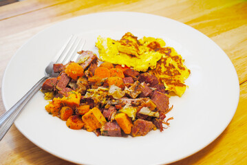 Corned Beef Hash with a Side Dish of Scrambled Eggs