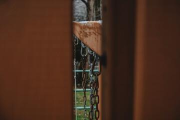 Swing chains on a backyard swingset in winter
