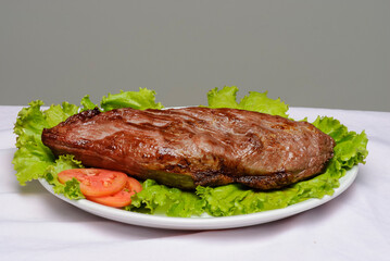 Barbecue sun dried beef with lettuce and tomato.
