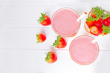 Strawberry  juice beverage healthy the taste yummy In glass drink episode morning on wooden background from the top view.