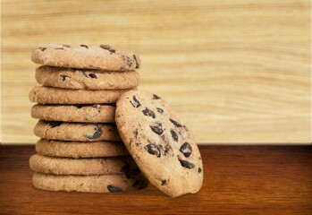 Peanut butter cookies stack on wooden board. Traditional american dessert, nutrition snack, dessert or breakfast food.