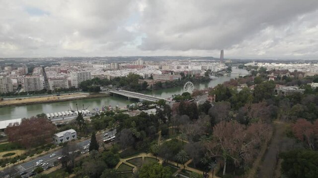 Flyover Maria luisa park towards Guadalquivir river on City center. Seville, Spain