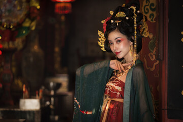 portrait of asian woman in traditional Chinese dress in Chinese shrine