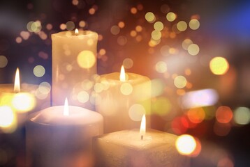 Abstract Advent, colored Candles With Soft Blurry Lights And Glittering On Flames