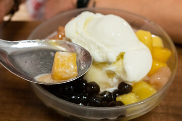 eating shaved ice with colorful dessert