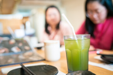 Abstract blurred people group sitting in japanese restaursnt waiting food and drink