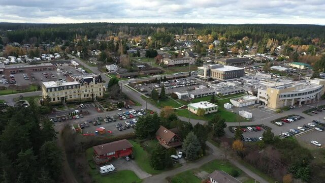 Cinematic 4K aerial drone trucking shot of Port Townsend's Victorian Manresa Castle Hotel