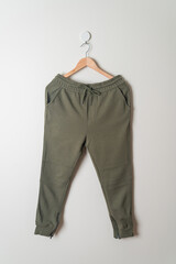 sweatpants or jogger pants hanging on wall