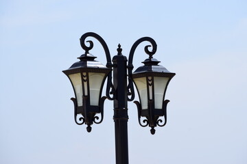 vintage street lamp in blue sky background 