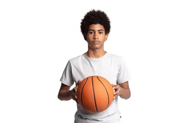 Gordijnen Portrait of serious caribbean adolescent man with afro hairstyle holding basketball and looking at camera © CristhianOmar