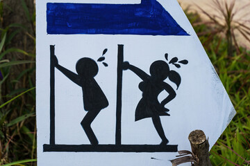sign with the inscription toilets. Indicative sign for toilet cubicles for men and women. Public toilet sign