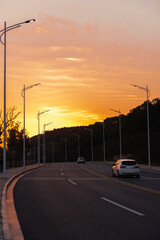 The city road in the setting sun.