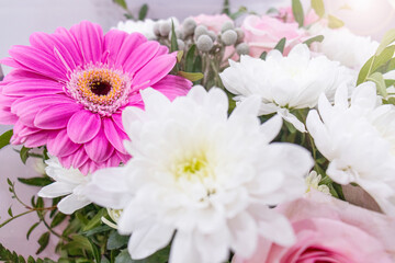 white-pink bouquet of delicate flowers.
pink gerberas and white chrysanthemums in a gentle romantic bouquet.
