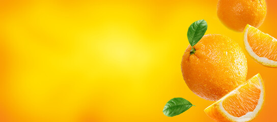 oranges with slices and leaves flying on light orange colour background. Background for packaging and label design