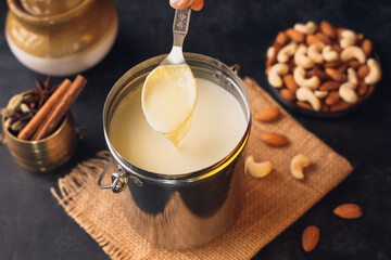 White thick layer of form over milk. Separate thick cream from milk. Curdled milk. Homogenized...