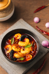 Serving Shrimp masala fish curry Chemmeen curry tiger Prawns balchao Curry. Spicy Kerala fish curry Indian seafood non veg food side dish rice appam Goan Tamil Nadu Bengal Sri Lankan