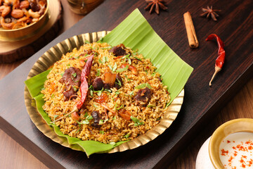 Mutton biryani Beef Biryani, Gosht or lamb biriyani Hyderabadi Dum biriyani with raita yoghurt dip special occasion Indian festival food Ramadan , Eid Hyderabad Kerala India Sri Lanka. Lankan food.