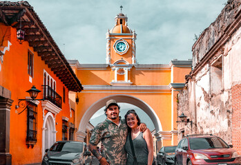 Couple Under Arco de Santa Catalina in Antigua, Guatemala