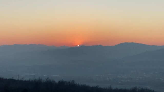 Time-lapse Epic sunset far away from the top of the hill