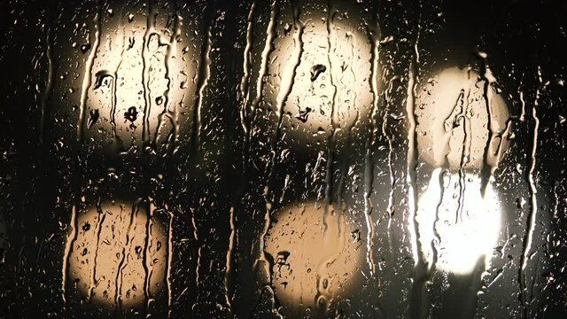 Various shots and camera movement of detailed rain drops falling on window. 4k closeup macro