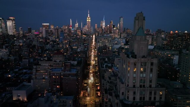 evening flying North over 5th Ave. towards midtown NYC