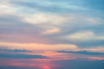 Beautiful sunset or sunrise sky in pastel soft shades of blue and pink - background