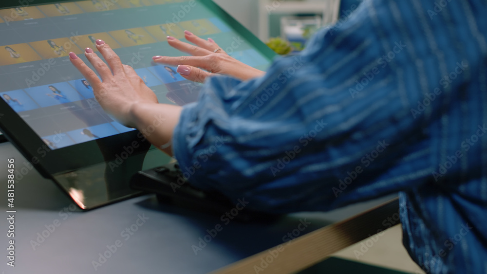 Poster close up of retouching software on touch screen computer at studio. hands of photographer editing pi