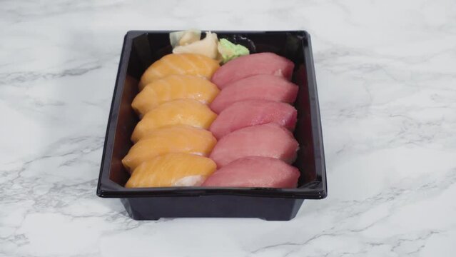 Pre-packaged sushi in a plastic tray.