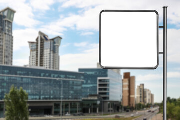 Blank advertising board near road in city. Space for text