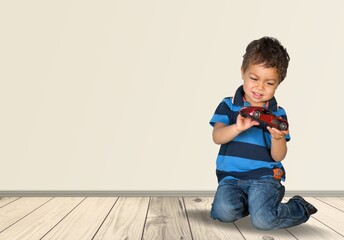Baby plays with educational toys on the floor. Toddler