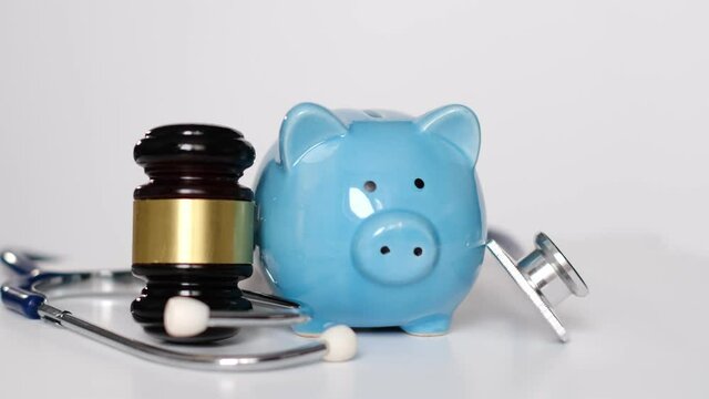 Stethoscope and judgement hammer. Gavel and stethoscope. medical jurisprudence. legal definition of medical malpractice. attorney. common errors doctors, nurses and hospitals make.