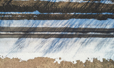 Railroad line in winter landscape
