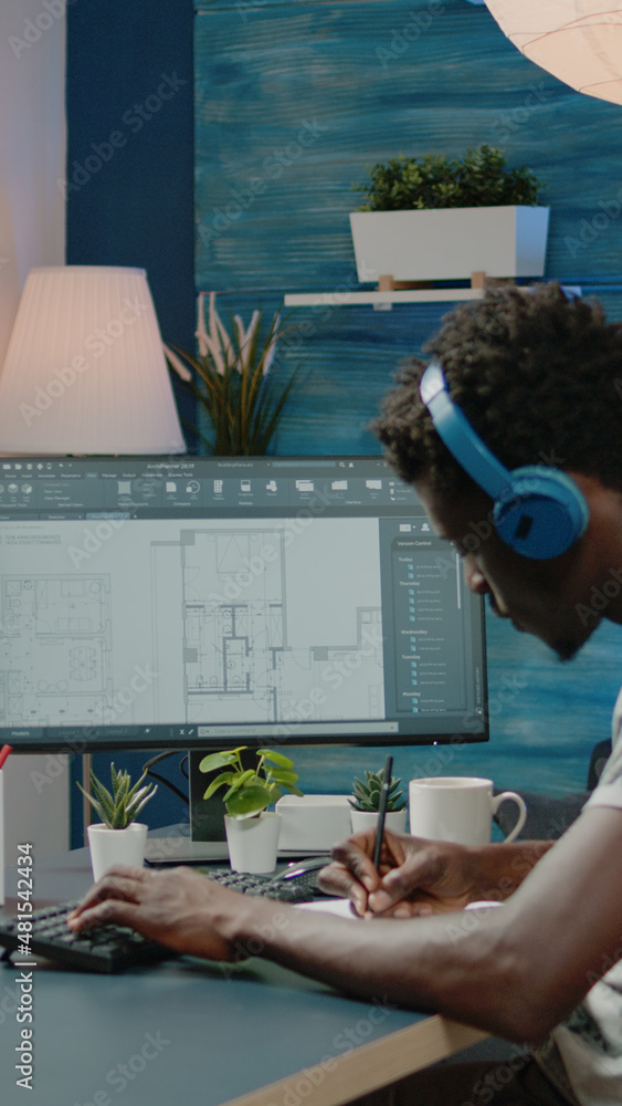 Poster person working with sketch of blueprint plan on computer to create floor layout for building constru