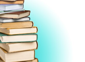 Stack of books in the colored cover lay on the table . Education learning concept