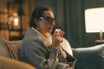 Sick woman with cold resting at home