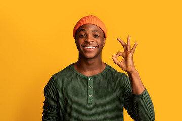 Portrait Of Positive Young Black Guy Showing Ok Gesture At Camera