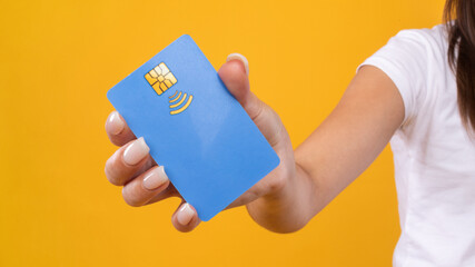 Close-up of woman hand holding plastic credit card