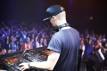 Playing to the adoring fans. Shot of a band playing at a music festival- This concert was created for the sole purpose of this photo shoot, featuring 300 models and 3 live bands. All people in this