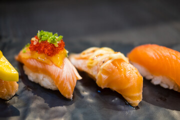 Delicious salmon sushi set. Asian cuisine and food culture.