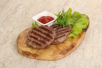 Grilled beef burger cutlet with sauce