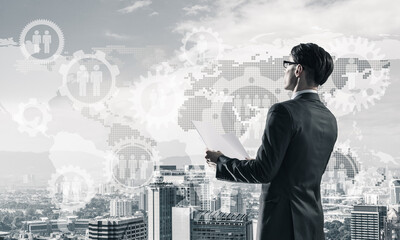 Concept of business success and control with confident boss against cityscape background