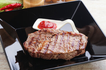Grilled rib-eye steak beef meat