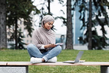 Fototapeta premium Remote education, outdoor workplace, education, study online in fall