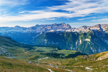 Fototapeta na wymiar Plateau in Julian Alps in Italy and mountainous range in the background