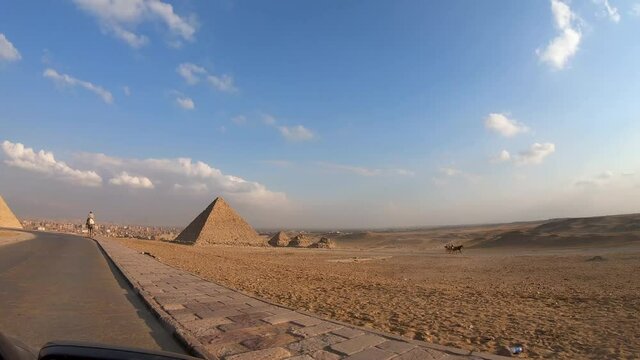 perspective of giza pyramids from the car