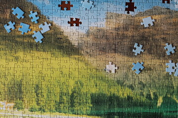 puzzles lie on a wooden table