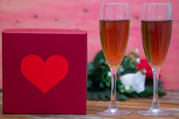 valentine's day greeting card with gift box, roses and champagne
