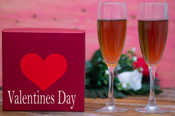 gift box with hearts, glasses of champagne and roses. happy Valentines Day
